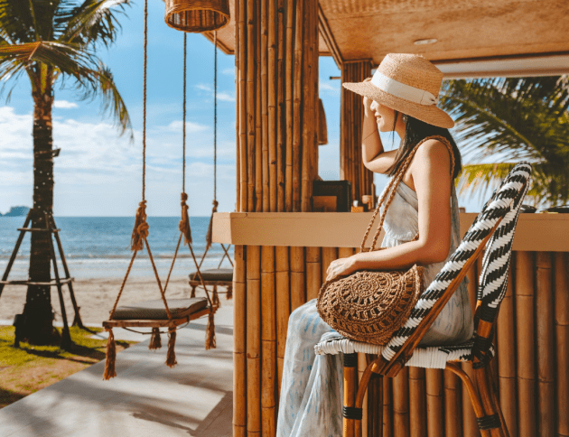 travel-summer-vacation-concept-happy-traveler-asian-woman-with-hat-dress-relax-swing-beach-cafe-koh-chang-thailand.png